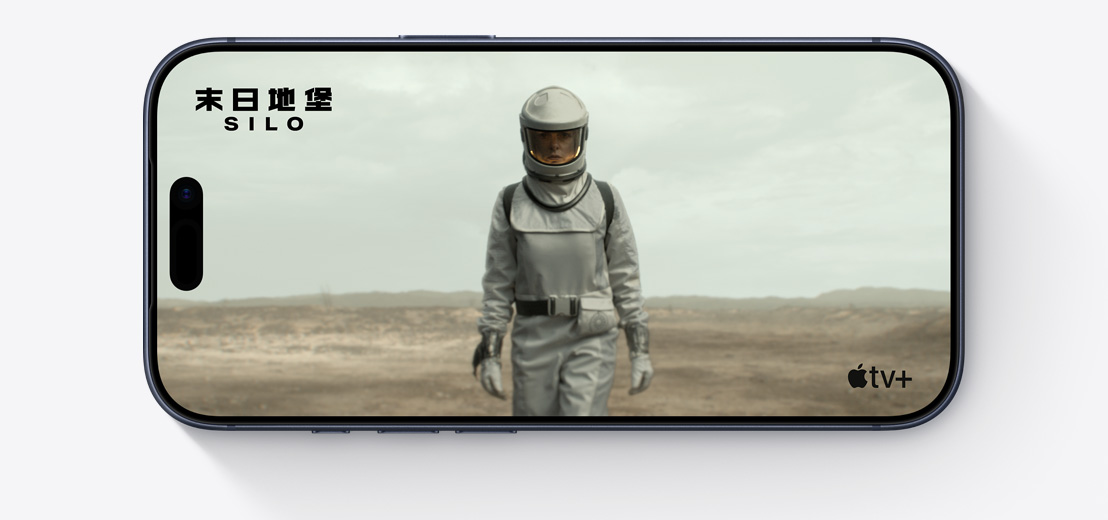 iPhone front exterior, horizontal, Apple TV clip of person in spacesuit, Silo