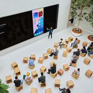 Bird's-eye view of a business training at an Apple Store.